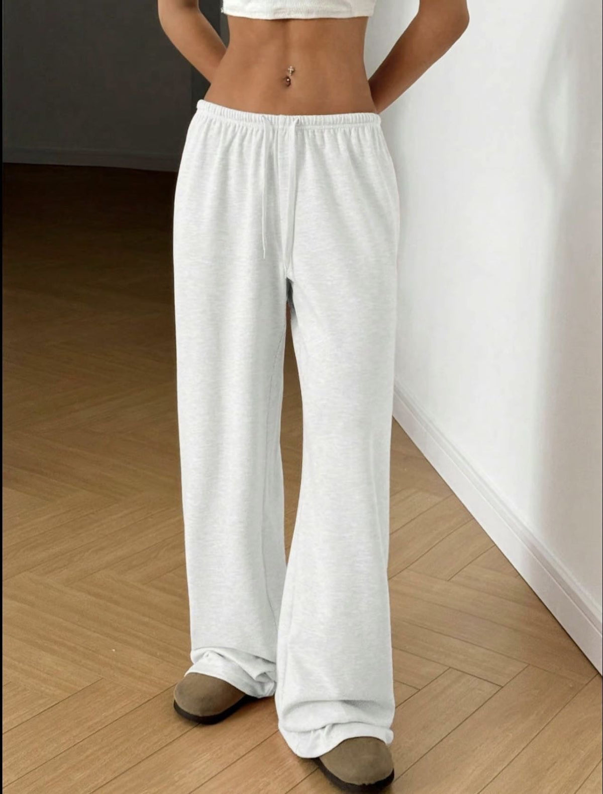 White wide-leg sweatpants with elastic waistband and drawstring, straight relaxed leg