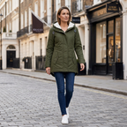 Women’s insulated winter coat in dark green with hood, zip front, and side pockets