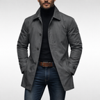 Men's weather-resistant overcoat in dark gray, button front, notched collar, side pockets.