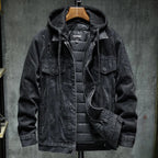 Denim jacket in dark black with hood, snap front, and two chest flap pockets