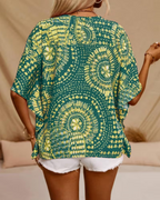 Oversized green tunic blouse back with short loose sleeves and ornate yellow circular print