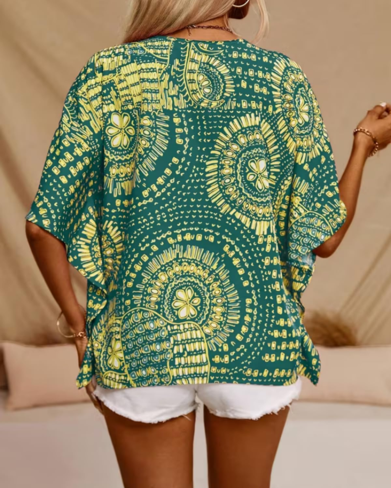Oversized green tunic blouse back with short loose sleeves and ornate yellow circular print
