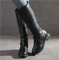 Black knee-high flat-heel boots with buckle strap and slight rounded toe.