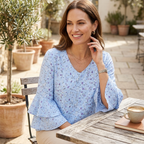 Light blue floral print V-neck blouse with ruffled 3/4 bell sleeves, relaxed fit