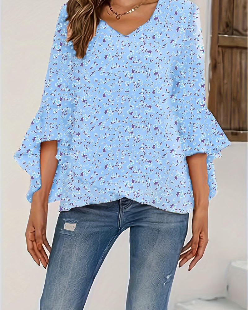 Light blue floral V-neck blouse with loose fit and 3/4 bell sleeves