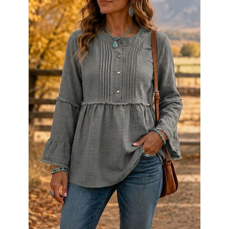 Grey pintucked peplum blouse with button-front and long flared sleeves