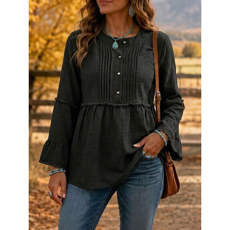 Black pintucked peplum blouse with button-front and long flared sleeves