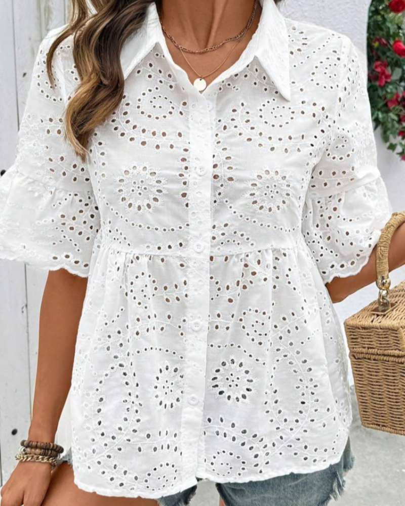 White peplum blouse with button-down collar and puff sleeves with eyelet embroidery