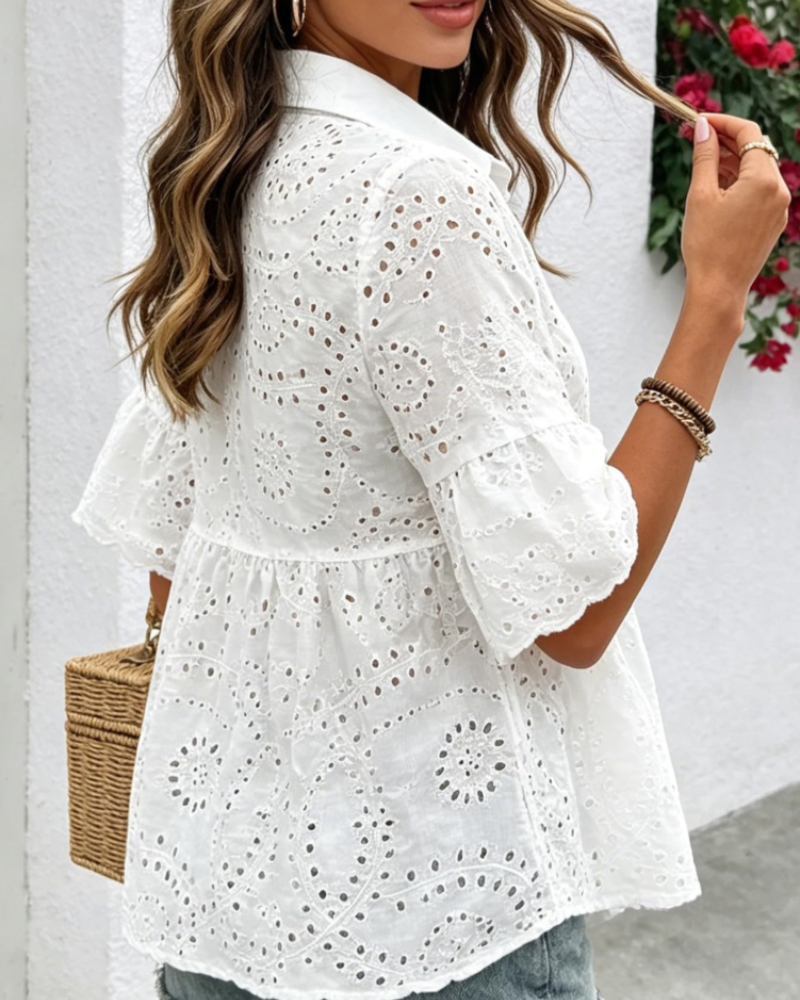 White embroidered peplum blouse with layered ruffle hem and puff sleeves
