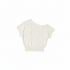 White one-shoulder knit top with floral applique and short batwing sleeves