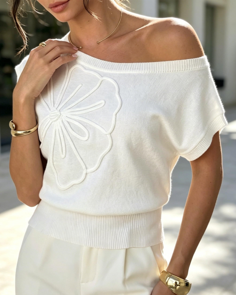 White knit one-shoulder top with embroidered daisy applique, short batwing sleeves