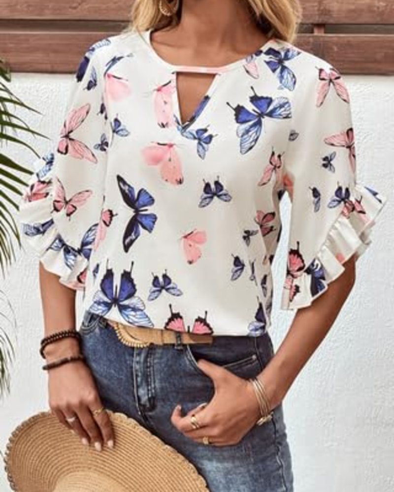 White short-sleeve blouse with colorful butterfly print and round neckline