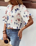 White floral butterfly blouse with notch neckline and fluttering short sleeves