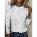 Pearl long-sleeve tunic with embossed floral scroll pattern, round neckline