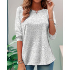 Pearl long-sleeve tunic with embossed floral scroll pattern, loose fit