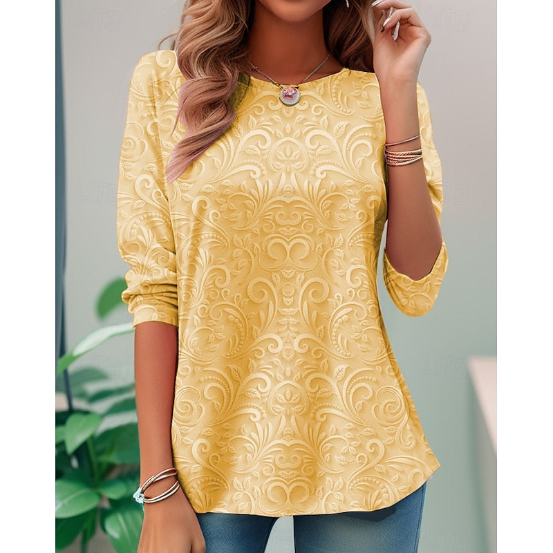 Yellow long-sleeve tunic with embossed floral scroll pattern and curved hem