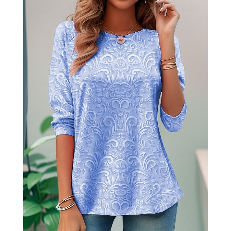 Blue long-sleeve tunic with embossed floral scroll pattern and round neckline
