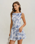 Floral print mini dress with boat neck sleeveless bodice and tiered skirt, blue on white