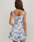 Back view floral print mini dress, sleeveless boat neck, blue pattern on white