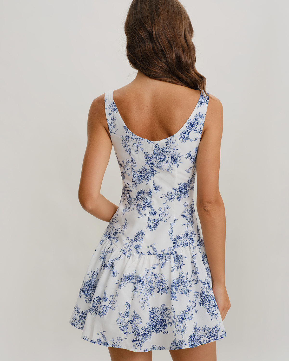 Back view floral print mini dress, sleeveless boat neck, blue pattern on white