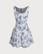 Floral print mini dress on white with sleeveless boat neck and tiered skirt, blue
