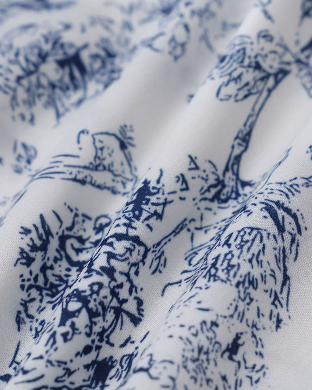 Blue floral pattern fabric panel on white background for mini dress