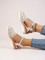 Beige crochet espadrille sandals with ankle strap and cutout side detail