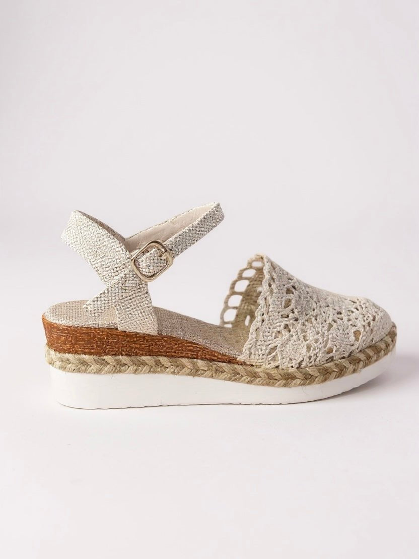 Beige crochet espadrille sandal with ankle strap, woven sole, and buckle