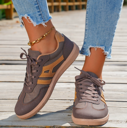 Women’s brown low-top lace-up sneakers with panel details and gum rubber sole