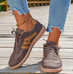 Women’s brown low-top lace-up sneakers with panel details and gum rubber sole