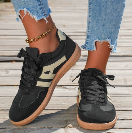 Women’s black low-top lace-up sneakers with panel stripes and gum rubber sole