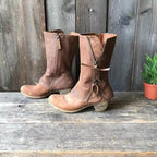 Brown mid-calf side-zip boots with stitched paneling and low block heels