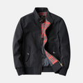 Black vintage casual jacket with stand collar, front zipper, and red plaid lining