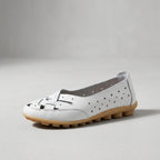 White leather loafer with perforations and stitching, low cushioned sole