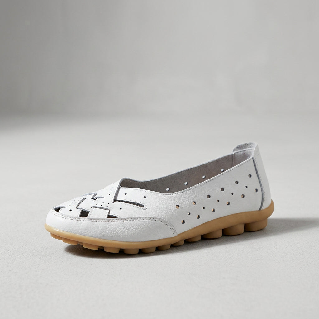 White leather loafer with perforations and stitching, low cushioned sole