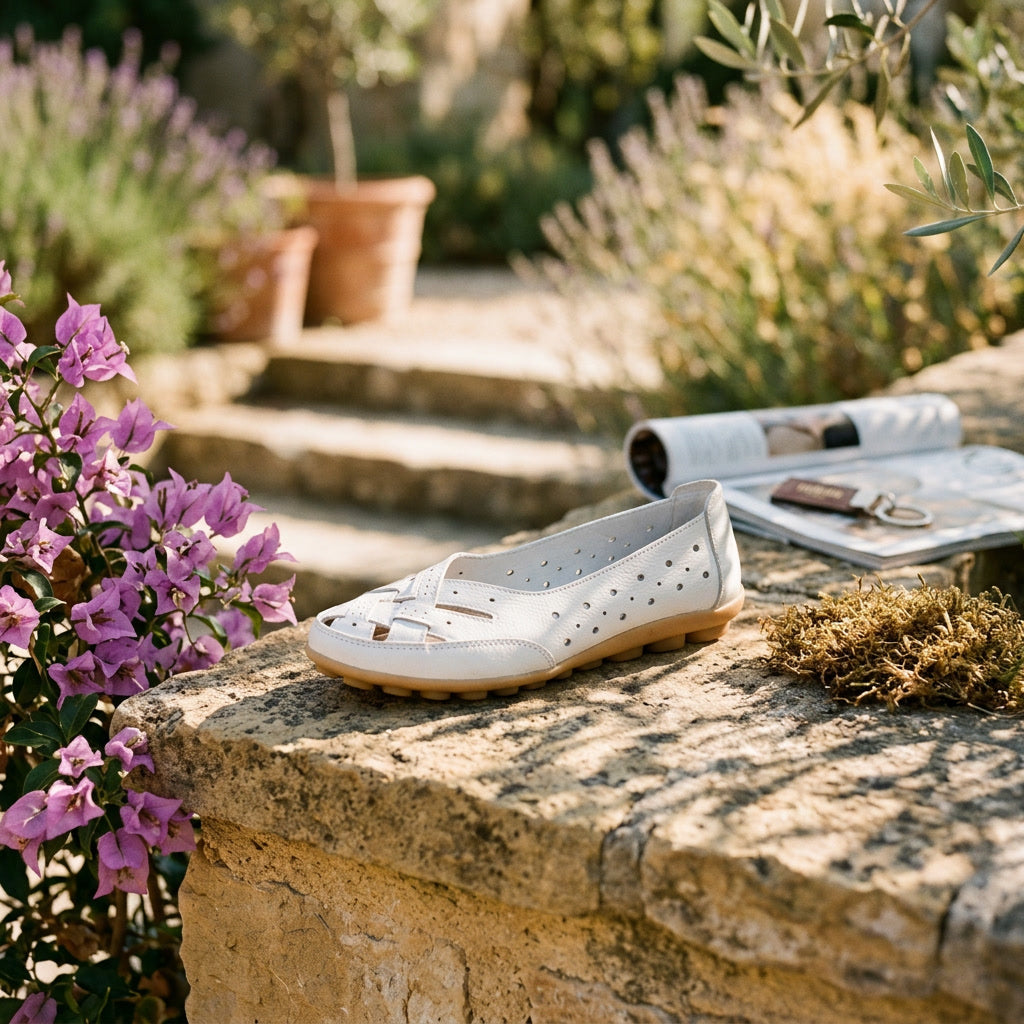 White leather loafers with perforated upper and stitched detail, comfort sole