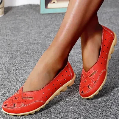 Red leather slip-on loafers with perforated panels and low cushioned outsole