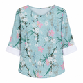 Blue-green floral print blouse with round neck and short sleeves, button front.