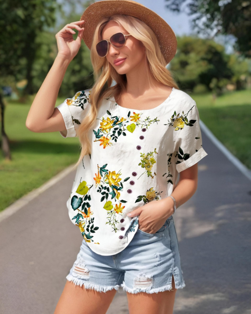 Lightweight floral blouse with round neck and short sleeves, white with colorful blossom print
