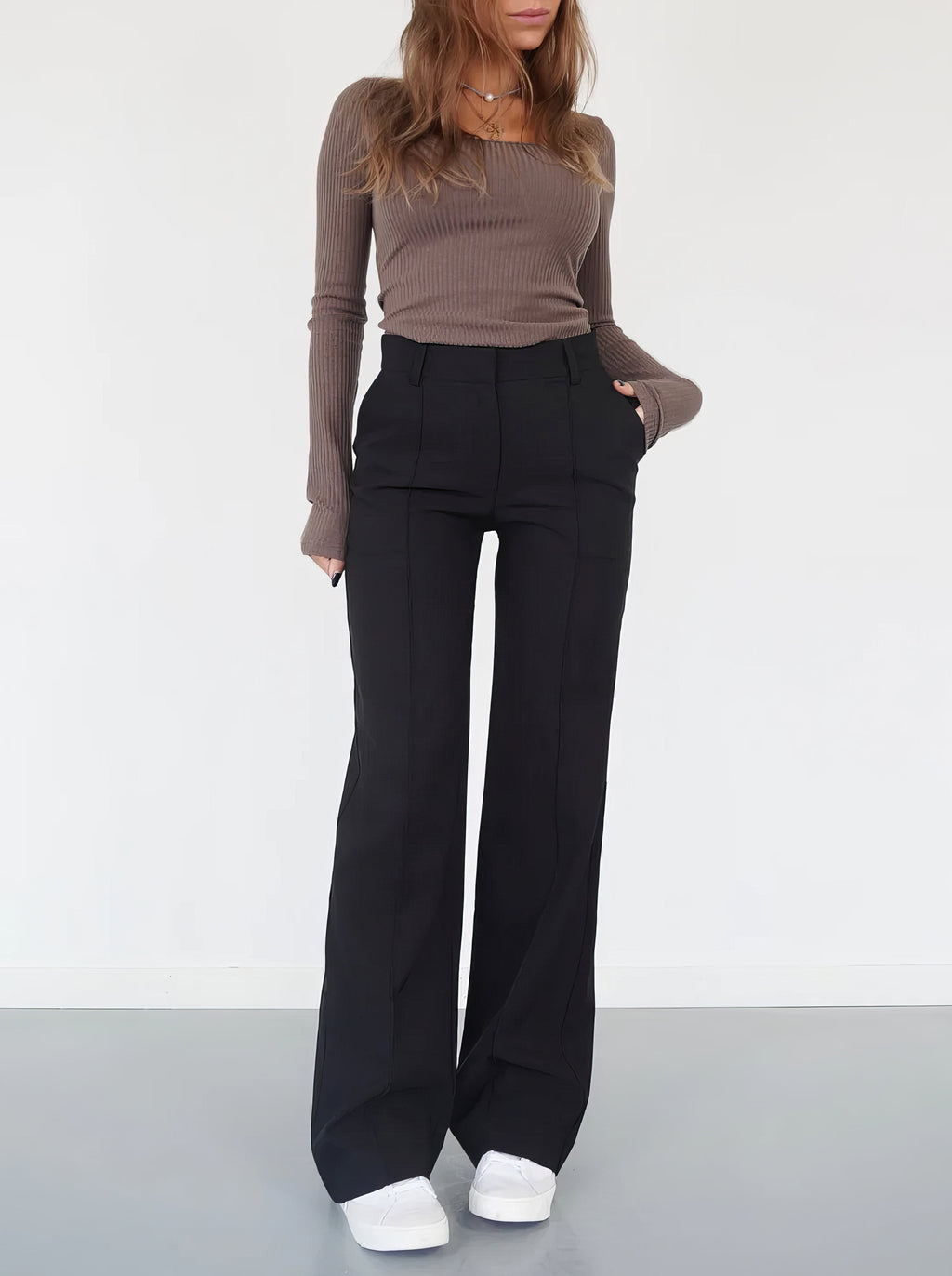 Black relaxed wide-leg trousers with high rise and straight, roomy legs