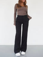 Black relaxed wide-leg trousers with high rise and straight, roomy legs