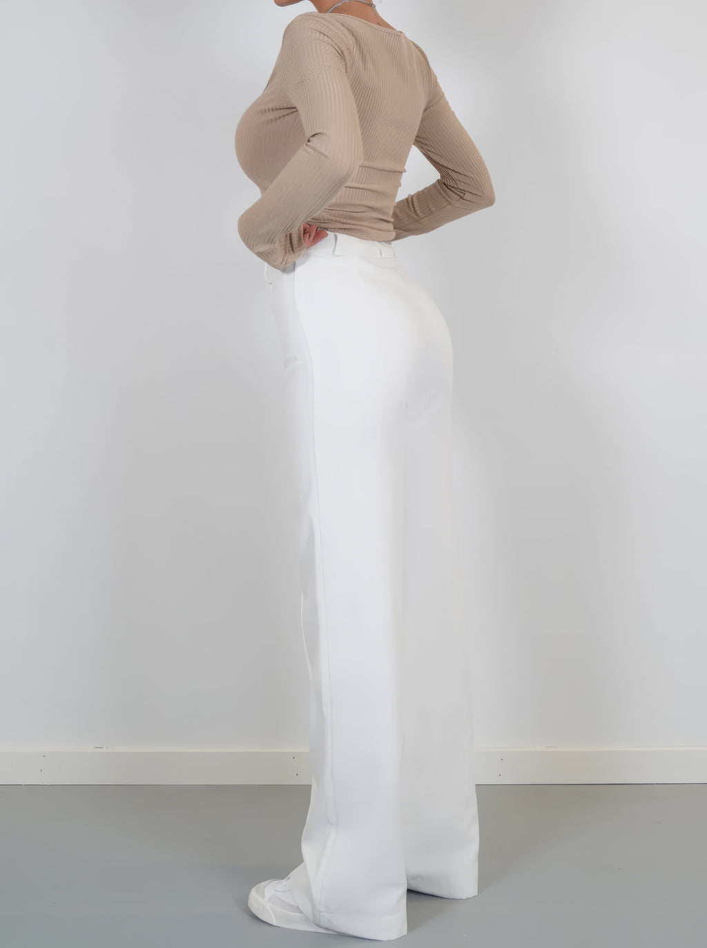 White relaxed wide-leg trousers with high waist and wide flared leg