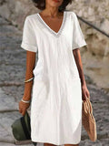 Women's white cotton V-neck short-sleeve dress with decorative trim and straight cut