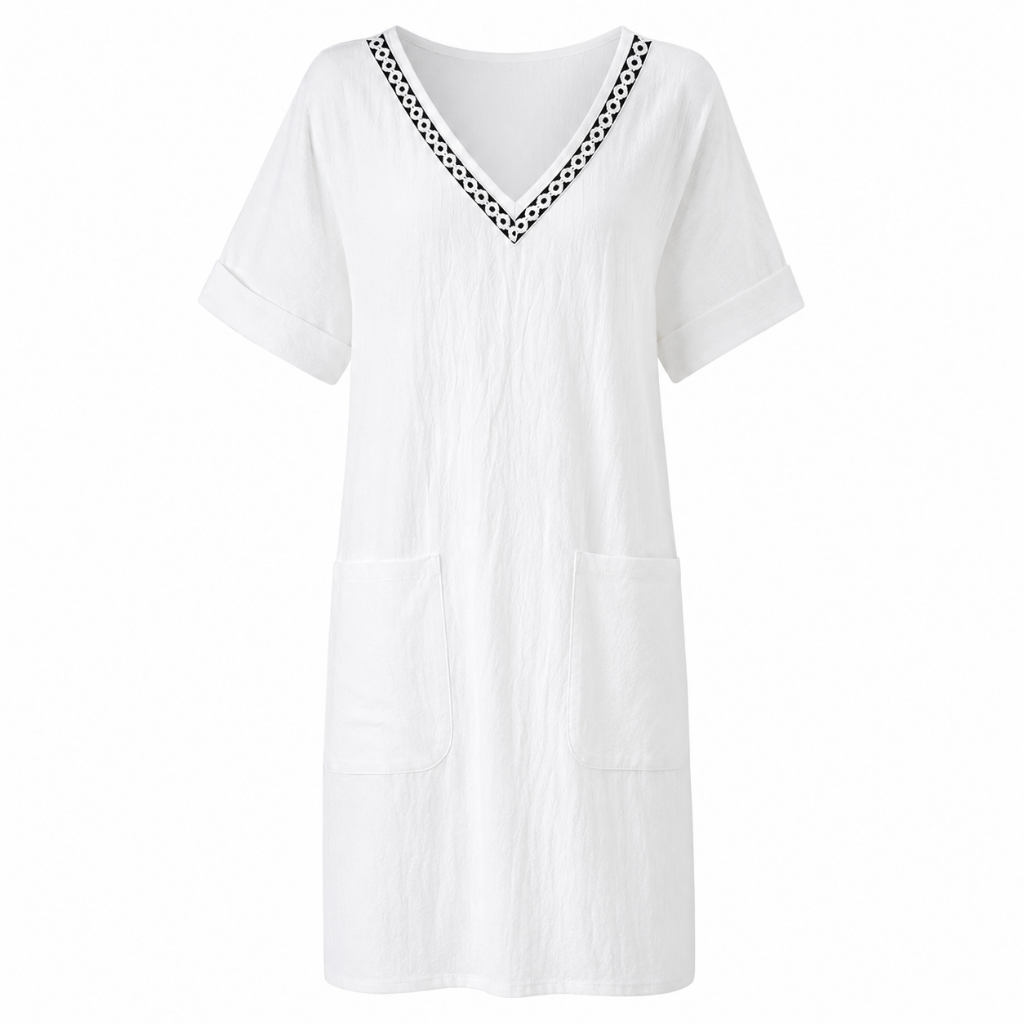 Women's white cotton V-neck shift dress with dark trim and short sleeves, patch pockets