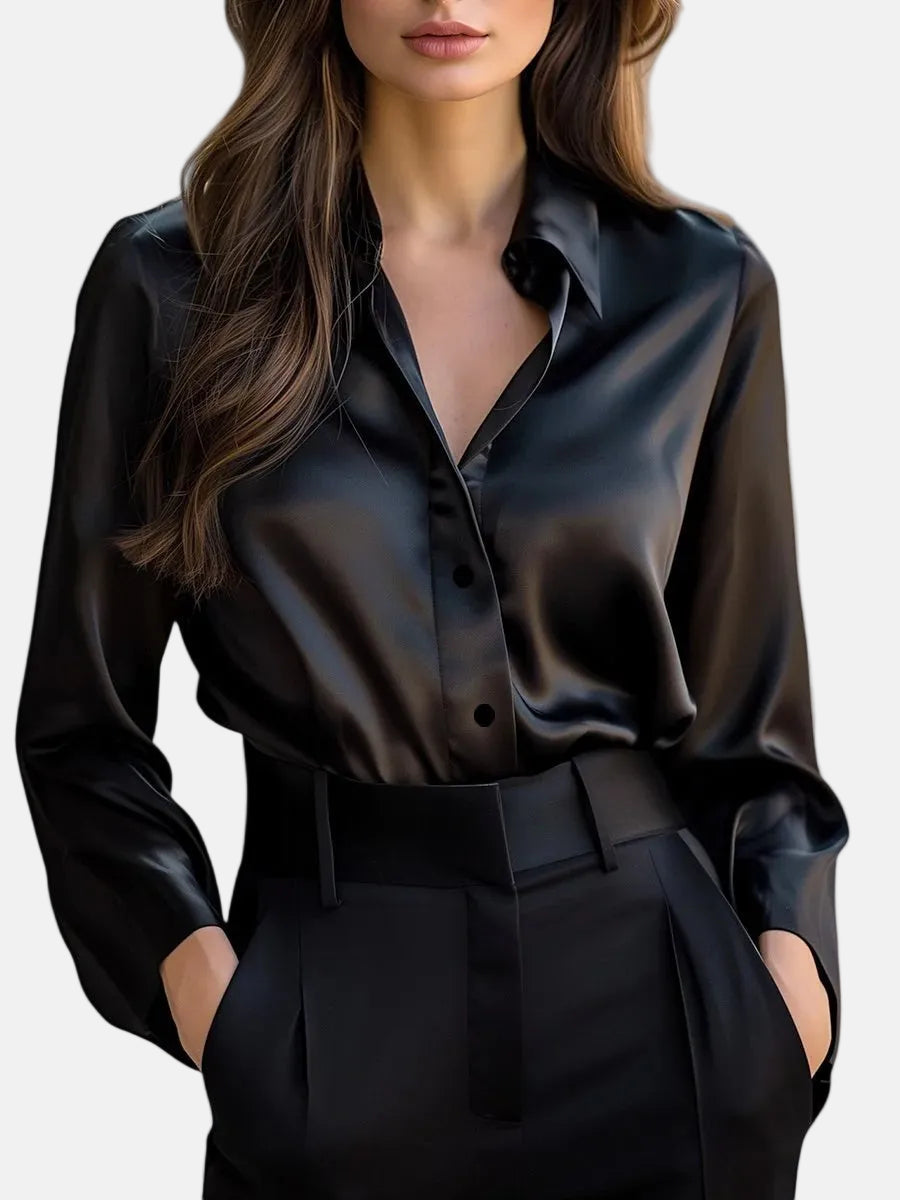 Black satin long-sleeve blouse with button front, pointed collar, and tie waist