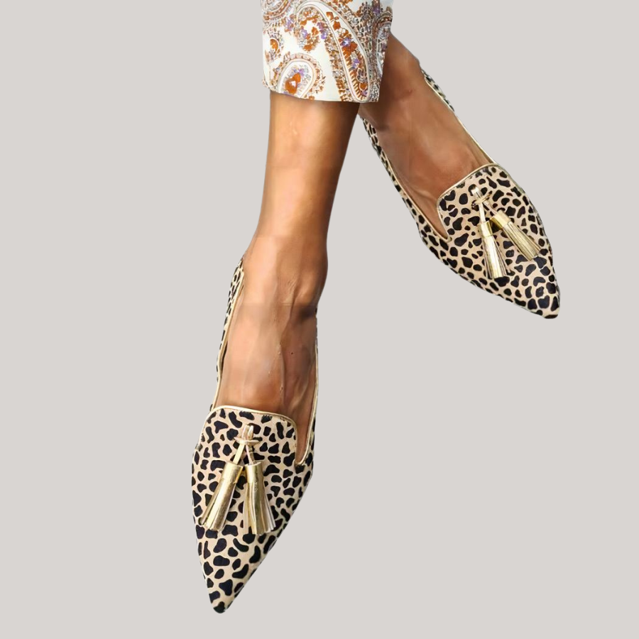 Women’s leopard leather moccasins with gold tassel trim and pointed toe