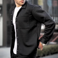 Black quilted casual jacket with button front and chest pocket detail