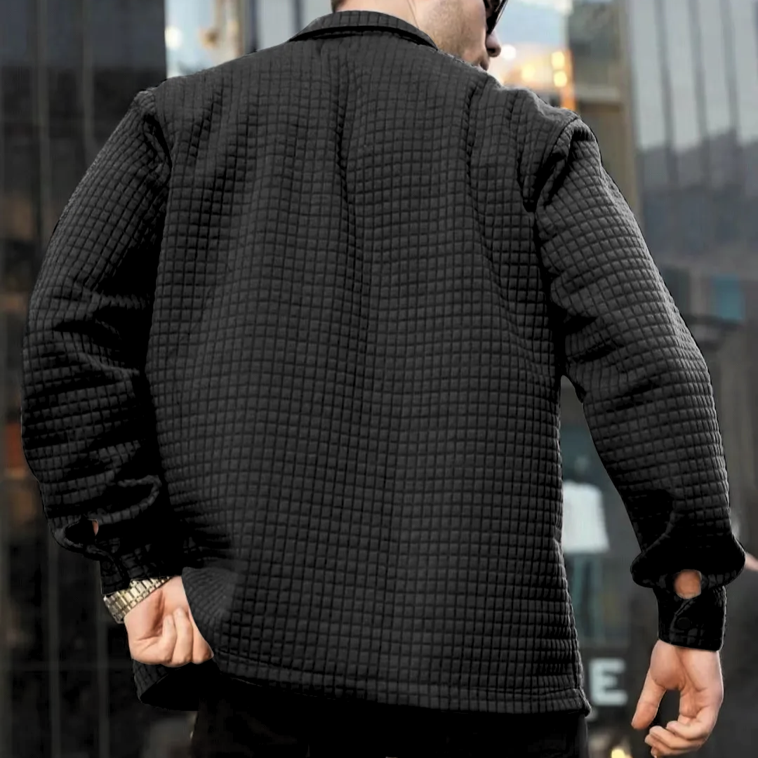 Black quilted casual jacket, back view with ribbed hem and cuffs