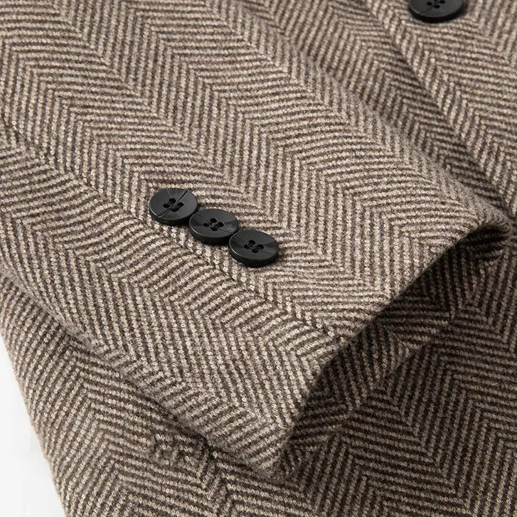 Khaki overcoat button detail on herringbone wool with overlapping placket