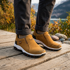 Tan casual shoes worn with rolled pant cuffs, white sole and tread detail